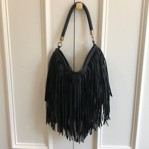 Black leather fringe purse with shirt and long strap.